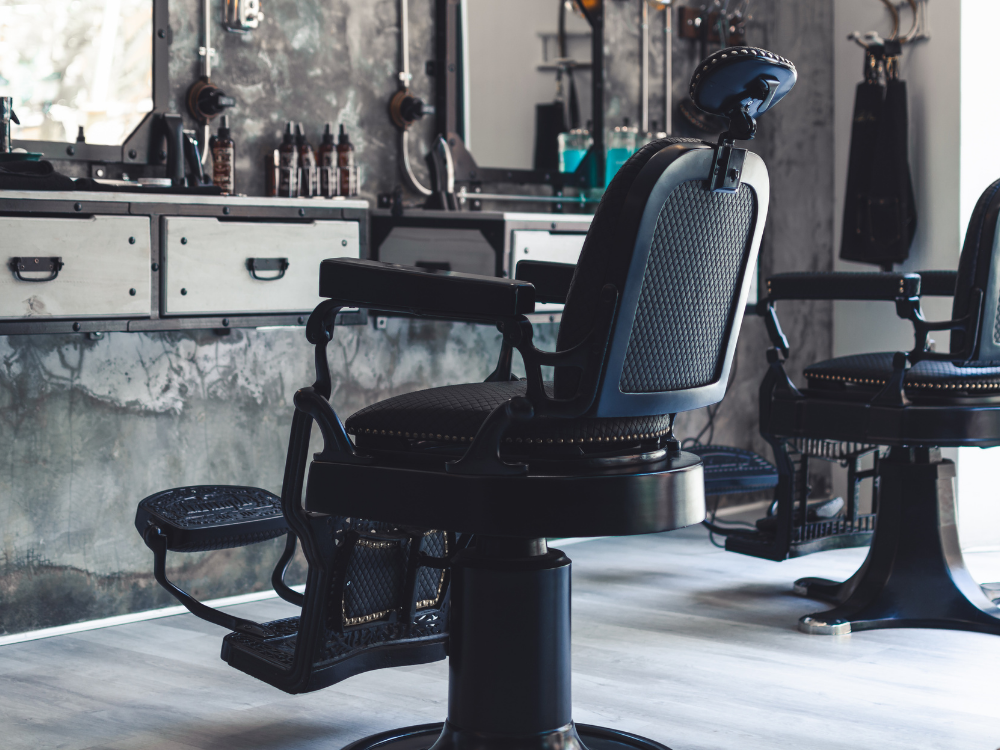 Classic heavy-duty hydraulic barber chair with plush leather upholstery and chrome base