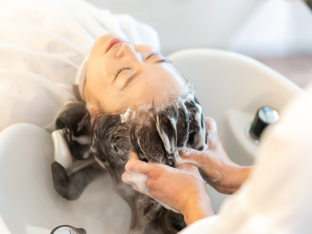 Modern salon shampoo unit with an ergonomic reclining chair and tilting wash bowl
