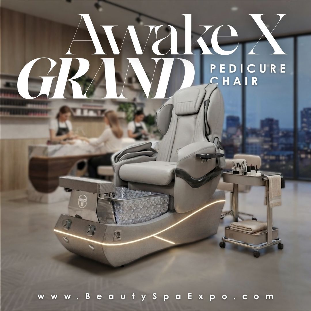 Luxury grey Awake X Grand pedicure chair with integrated foot basin and LED lighting in a high-end salon.