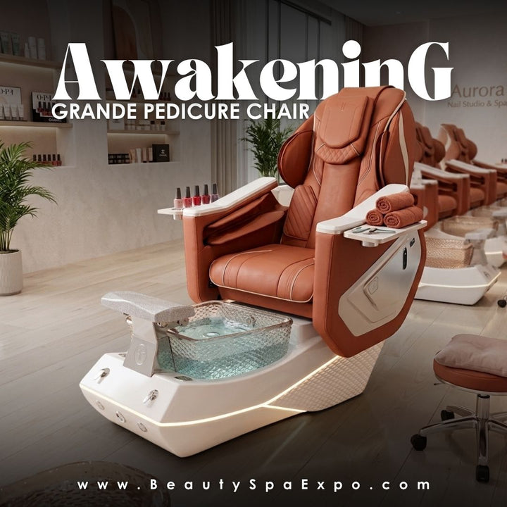 Awakening Grande Pedicure Chair in saddle brown leather with LED-illuminated textured base and crystal glass foot spa bowl in a modern nail salon setting.