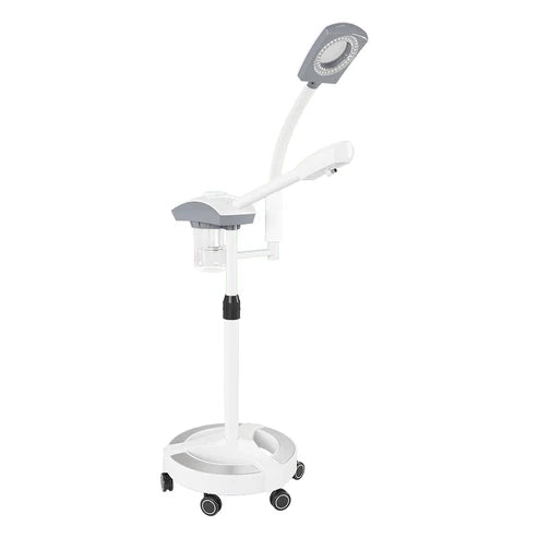 DIR NanoMist 3-in-1 facial steamer with magnifying lamp and aromatherapy on a white rolling stand for estheticians.