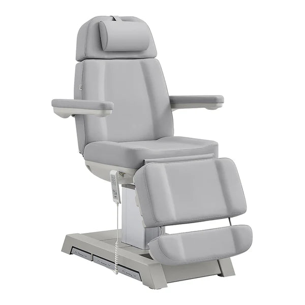All gray electric facial bed and medical spa chair by DIR, featuring adjustable headrest, armrests, leg extension, and a handheld remote control.