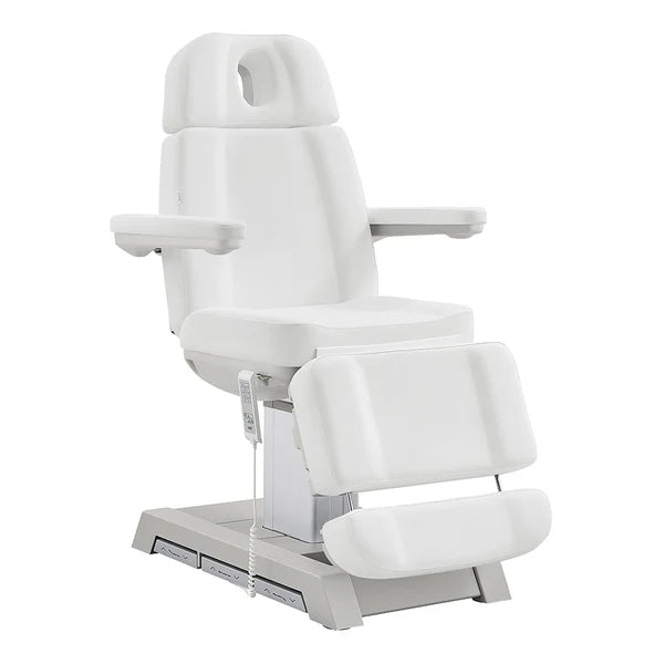 All-white electric facial bed and medical spa chair by DIR, featuring adjustable headrest, armrests, leg extension, and a handheld remote control.