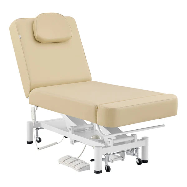 Beige WellRelax 2-motor electric therapy treatment table with adjusted backrest, tilting cradle pillow, hand remote, and foot pedal controls.