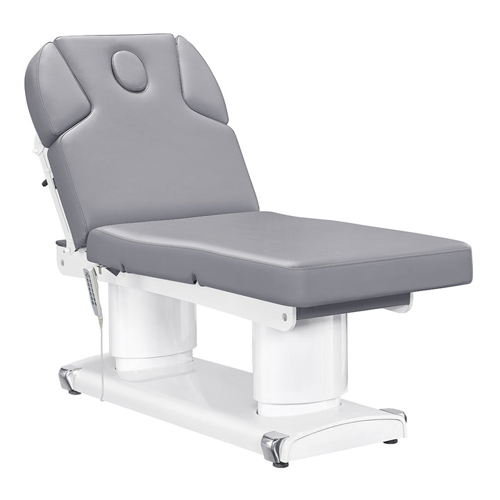 Luxi 4-motor electric medical spa treatment bed in premium Gray upholstery, featuring dual column lift base, hand remote, integrated foot controller, and adjustable headrest with side cushions.